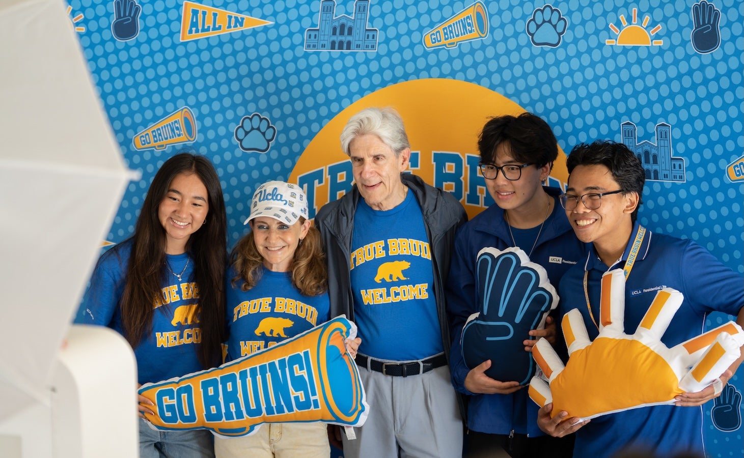 Julio Frenk and Felicia Knaul with 3 students in front of True Bruin sign