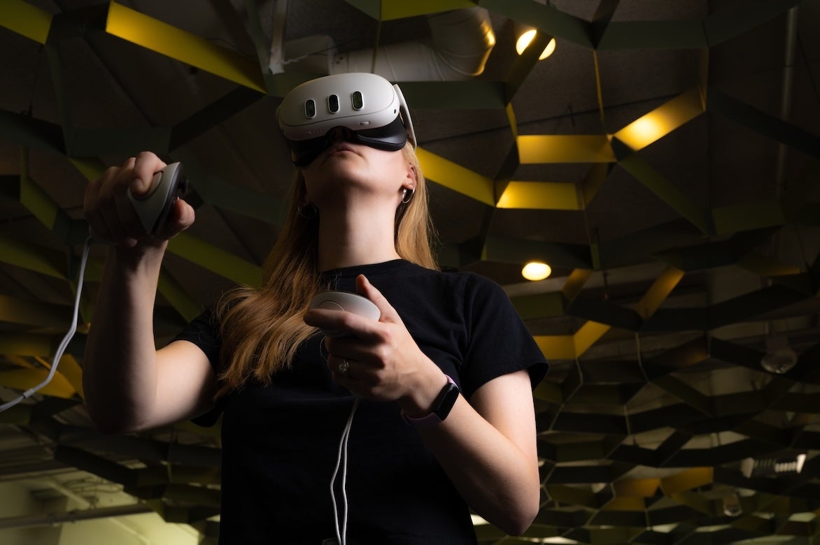 A woman wearing a virtual reality headset.